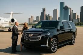 Professional chauffeur welcoming passengers at a private jet with a luxury black Mercedes sedan – USA Luxury Limo Service Houston airport transfer